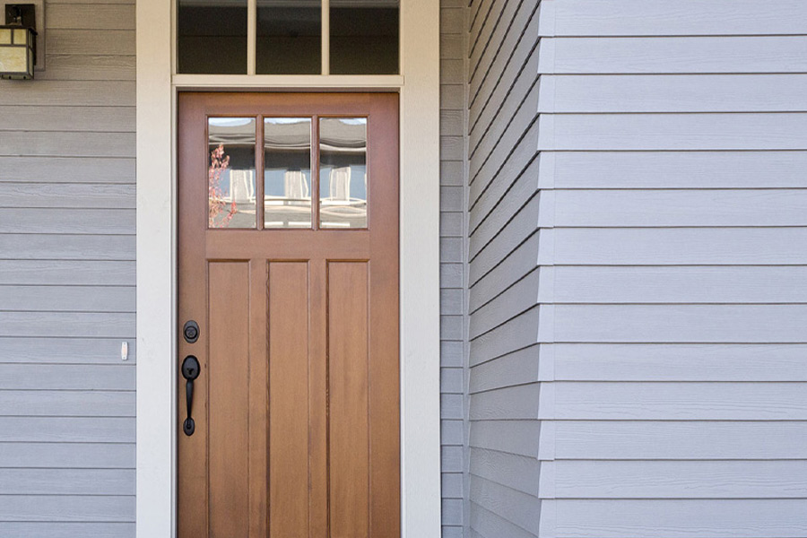home entrance with gray siding
