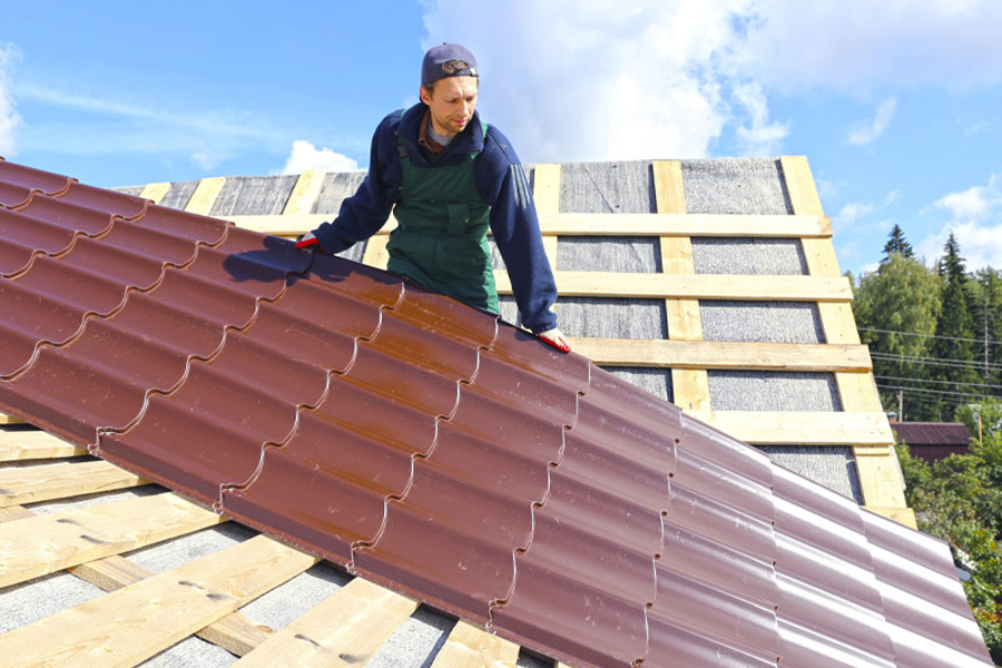 roofer installing a metal roof foil dublin ga